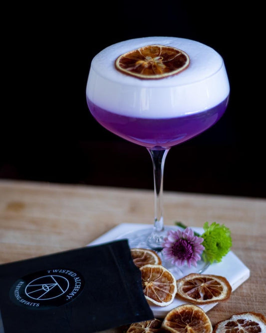 Purple ruth bader ginsburg cocktail shown with egg white