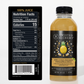 Twisted Alchemy pineapple juice bottle with nutrition facts label on a white background