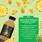 Twisted Alchemy 100% Cold Pressed Pineapple Juice bottle with pineapple slices on a green background