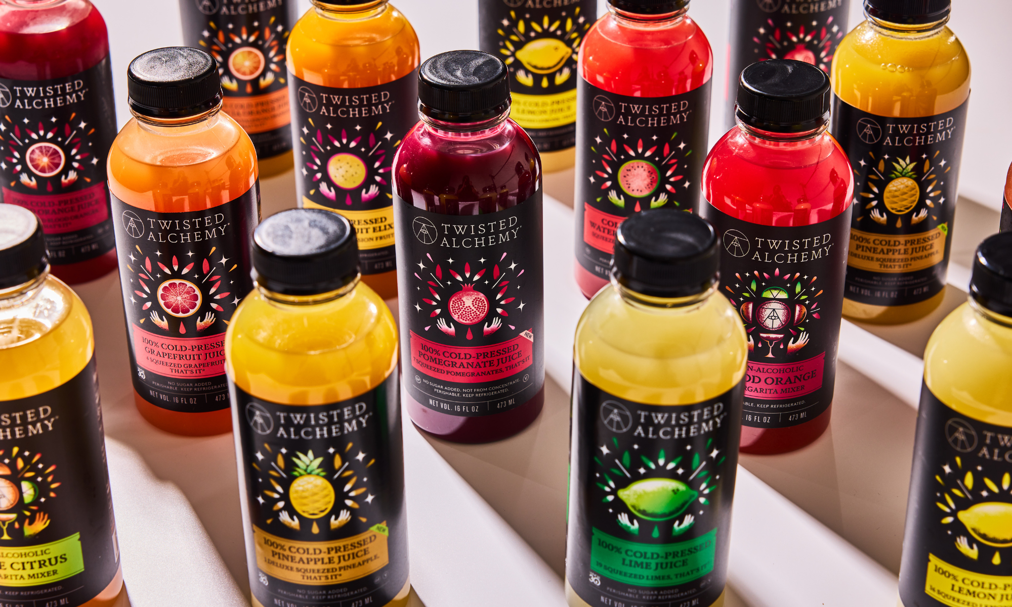 Collection of Twisted Alchemy juice bottles