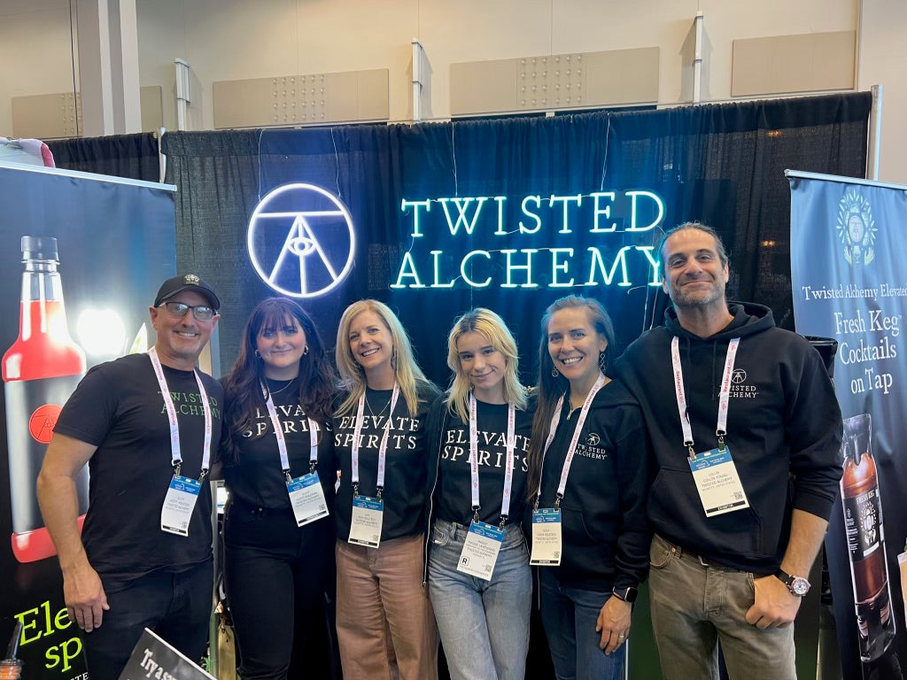 Group of wisted Alchemy associates promoting Twisted Alchemy cocktail juice