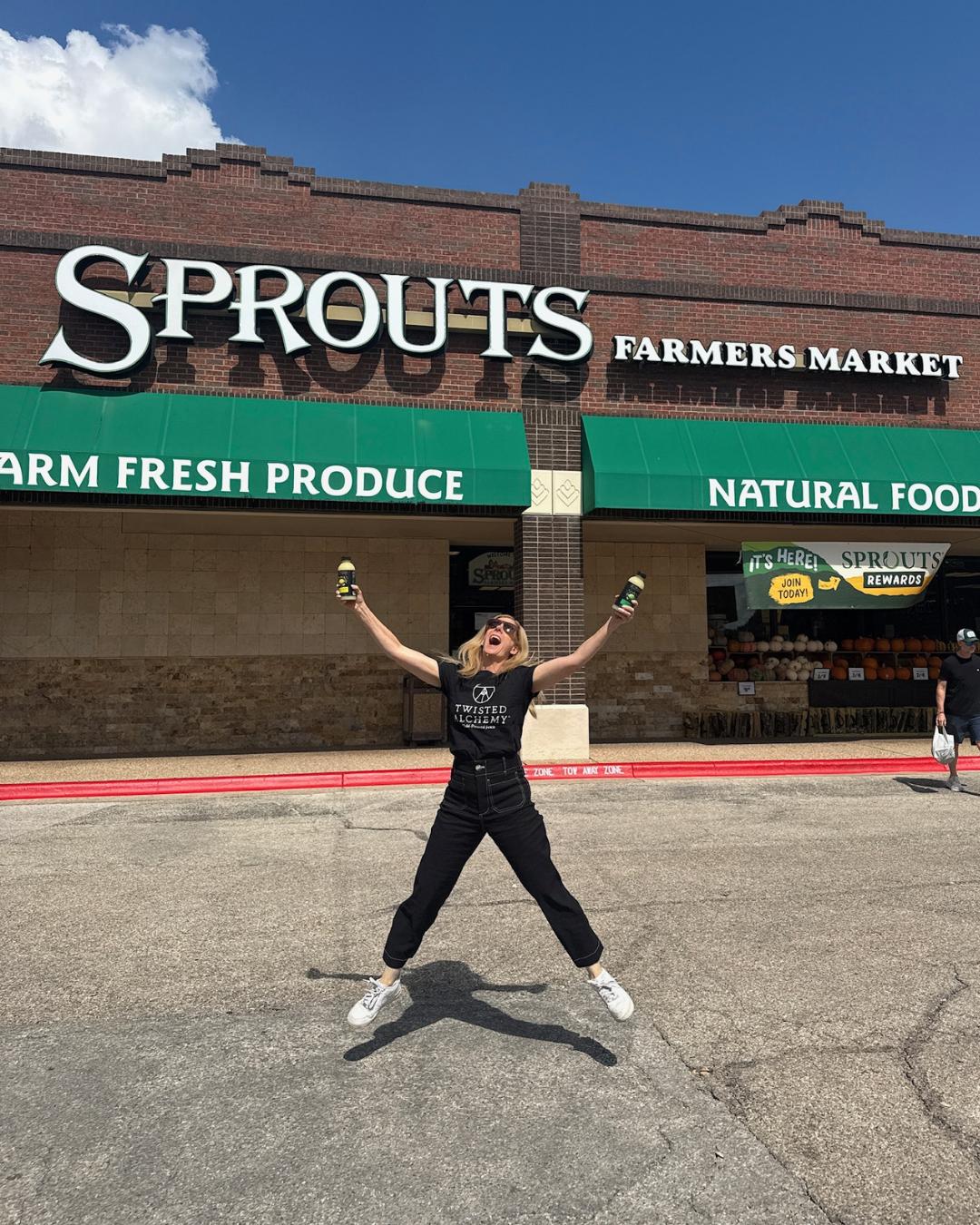 Kim jumping near sprouts store